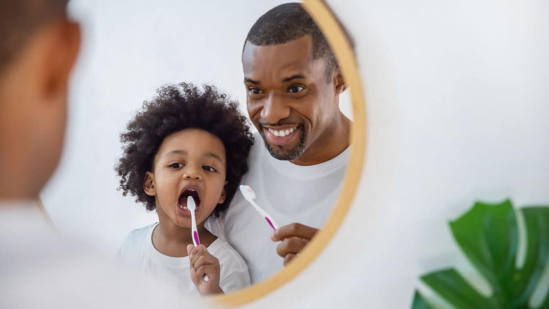 Patient Info Child and Father Brushing Teeth